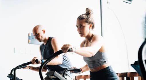 women building endurance on a jogging machine in gym canggu